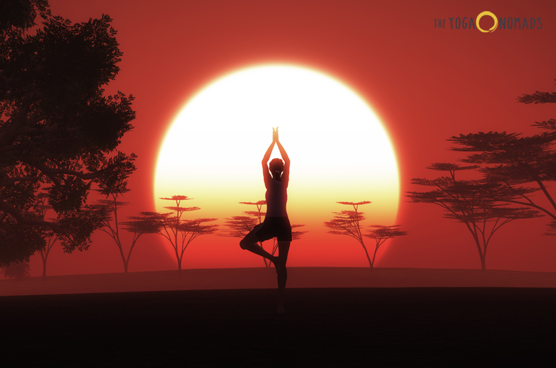 Sunrise in the background showing a woman doing a standing yoga pose